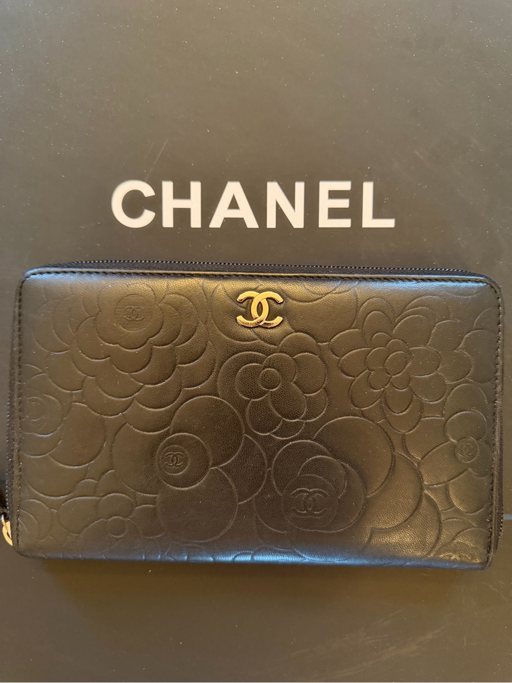 CHANEL Black Camellia-Embossed Zip Around Wallet with Silver CC